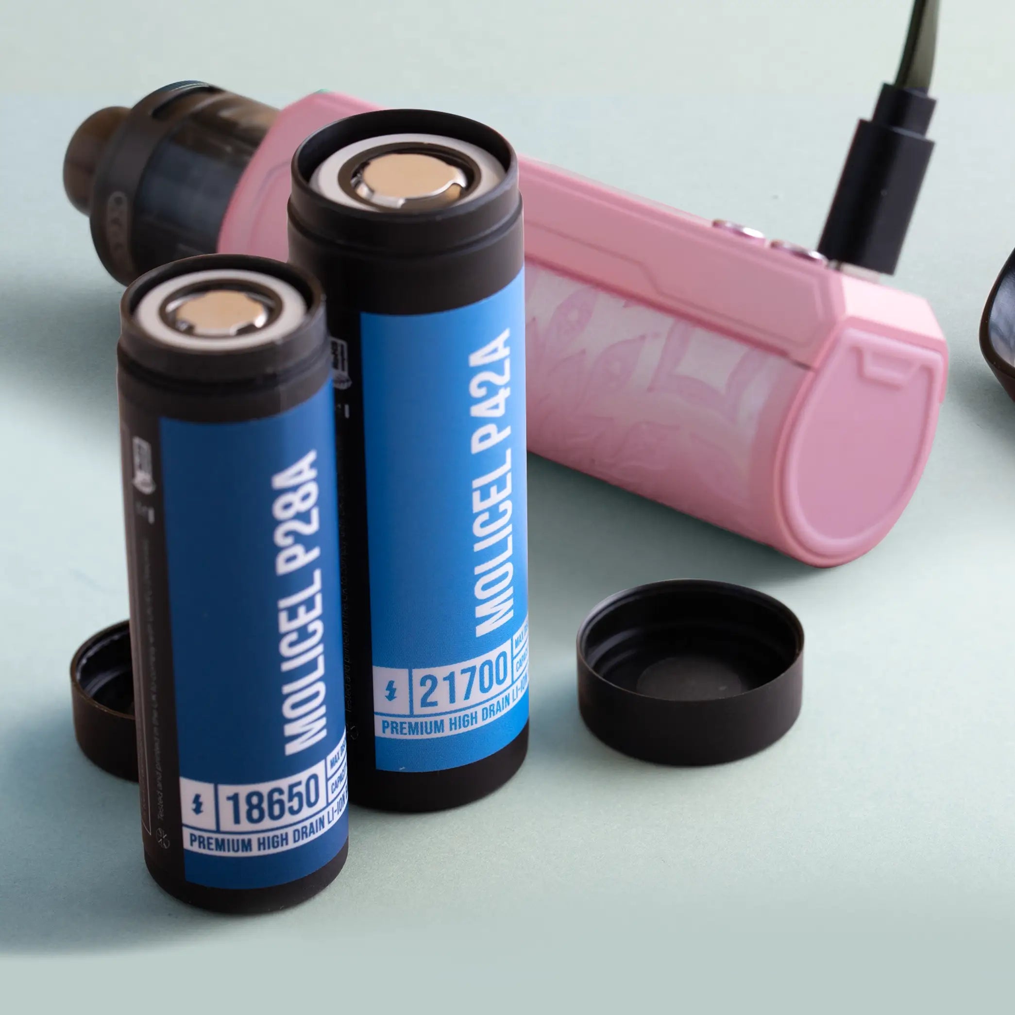 External and internal rechargeable batteries laid out on a light green background